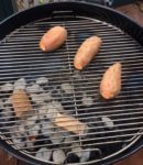 Our Smokinlicious wood chunks on the coals providing great smokey flavor for these smokey Sweet Potatoes