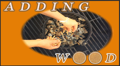 Showing the technique on how to add wood chips over charcoal with wood to enhance the flavor of any meat, fish, or vegetable being cooked